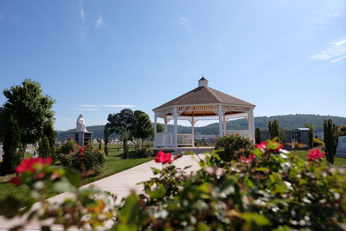 family-estate-lots-1 White Gazebo surrounded by pink rose bushes